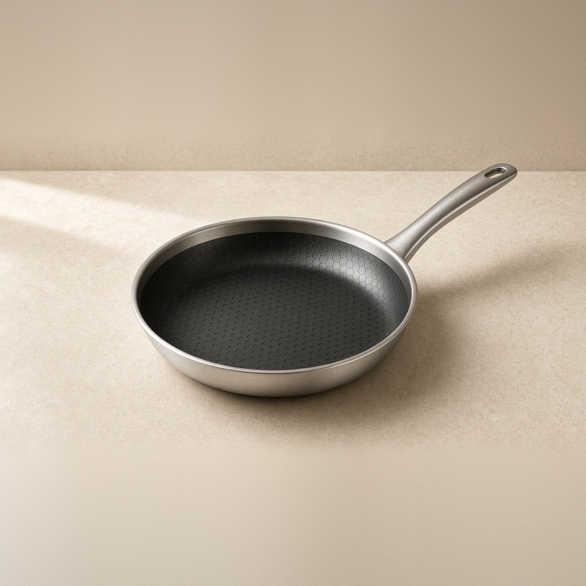 Emura-style hybrid frypan with honeycomb interior — full pan and handle in frame.